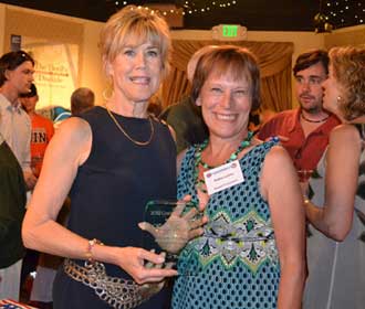Karen Roche, Gratitude Award winner, with Kathy Lyons, president of the board of School and Tutors on Wheels