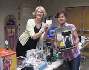 Raffle winner chooses prize at School and Tutors on Wheels end of the year party
